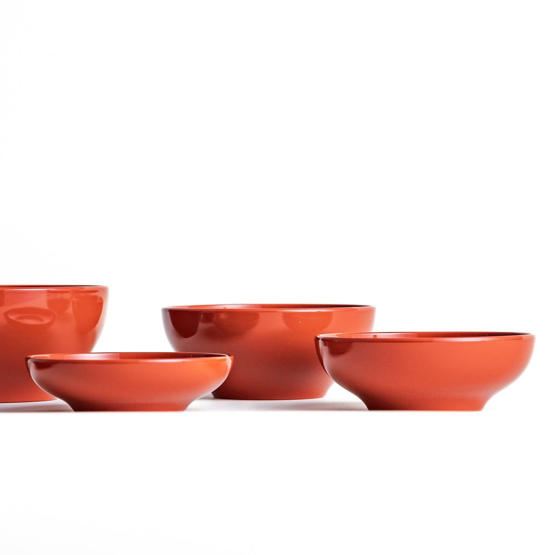 A set of five nested lacquer bowls, commonly used in oryoki meals, representing minimalism and mindfulness. Available in black or red.