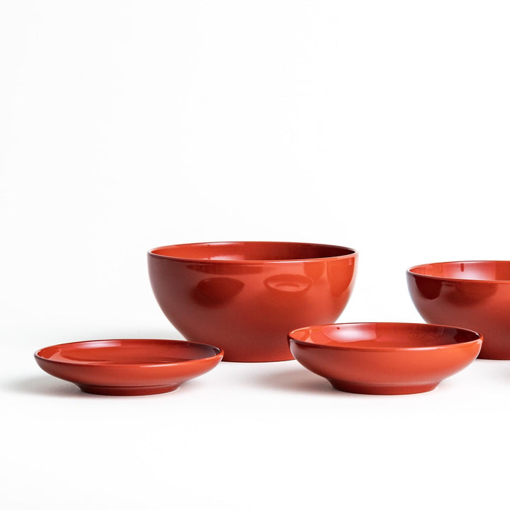 A set of five nested lacquer bowls, commonly used in oryoki meals, representing minimalism and mindfulness. Available in black or red.