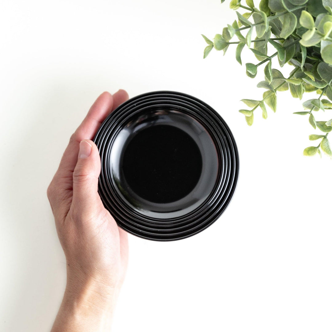 A set of five nested lacquer bowls, commonly used in oryoki meals, representing minimalism and mindfulness. Available in black or red.