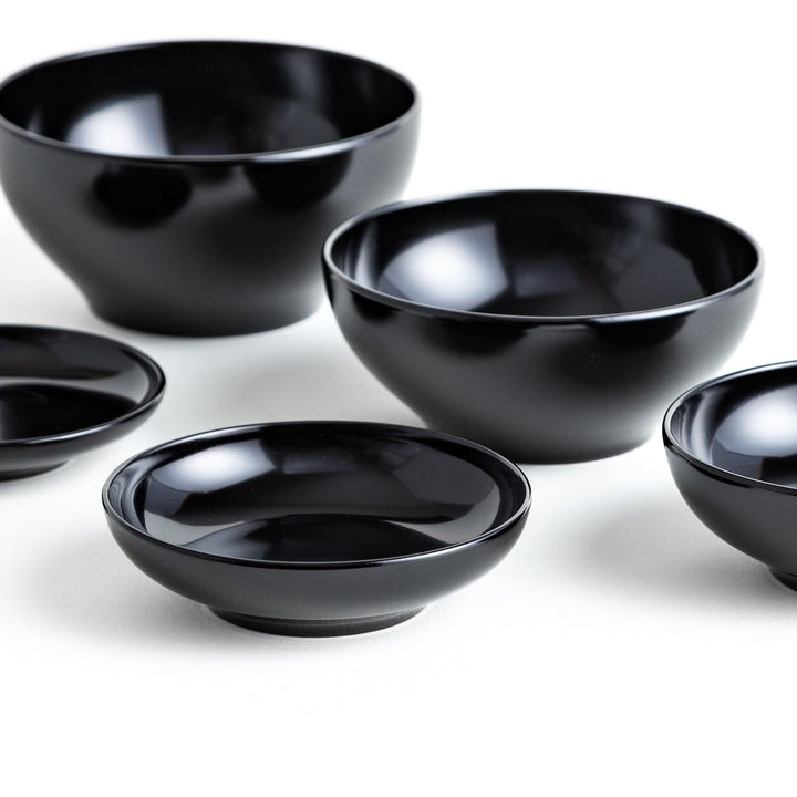 A set of five nested lacquer bowls, commonly used in oryoki meals, representing minimalism and mindfulness. Available in black or red.