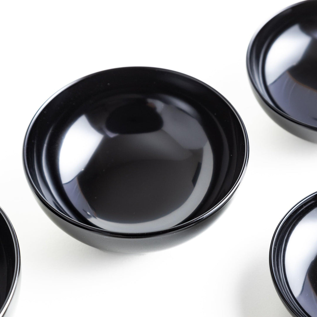 A set of five nested lacquer bowls, commonly used in oryoki meals, representing minimalism and mindfulness. Available in black or red.