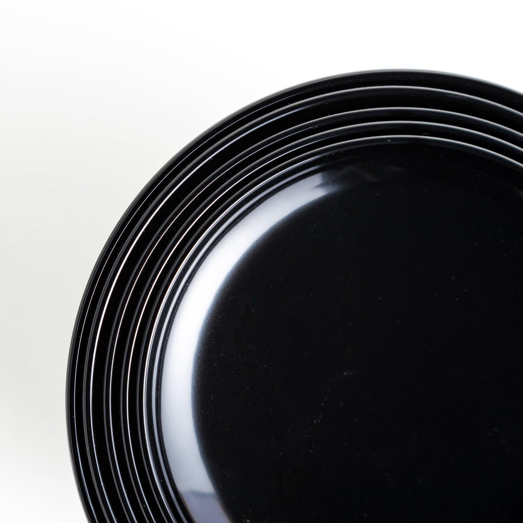 A set of five nested lacquer bowls, commonly used in oryoki meals, representing minimalism and mindfulness. Available in black or red.