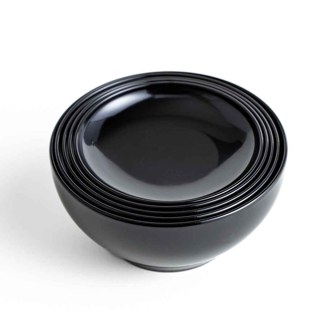 A set of five nested lacquer bowls, commonly used in oryoki meals, representing minimalism and mindfulness. Available in black or red.