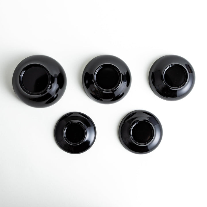 A set of five nested lacquer bowls, commonly used in oryoki meals, representing minimalism and mindfulness. Available in black or red.