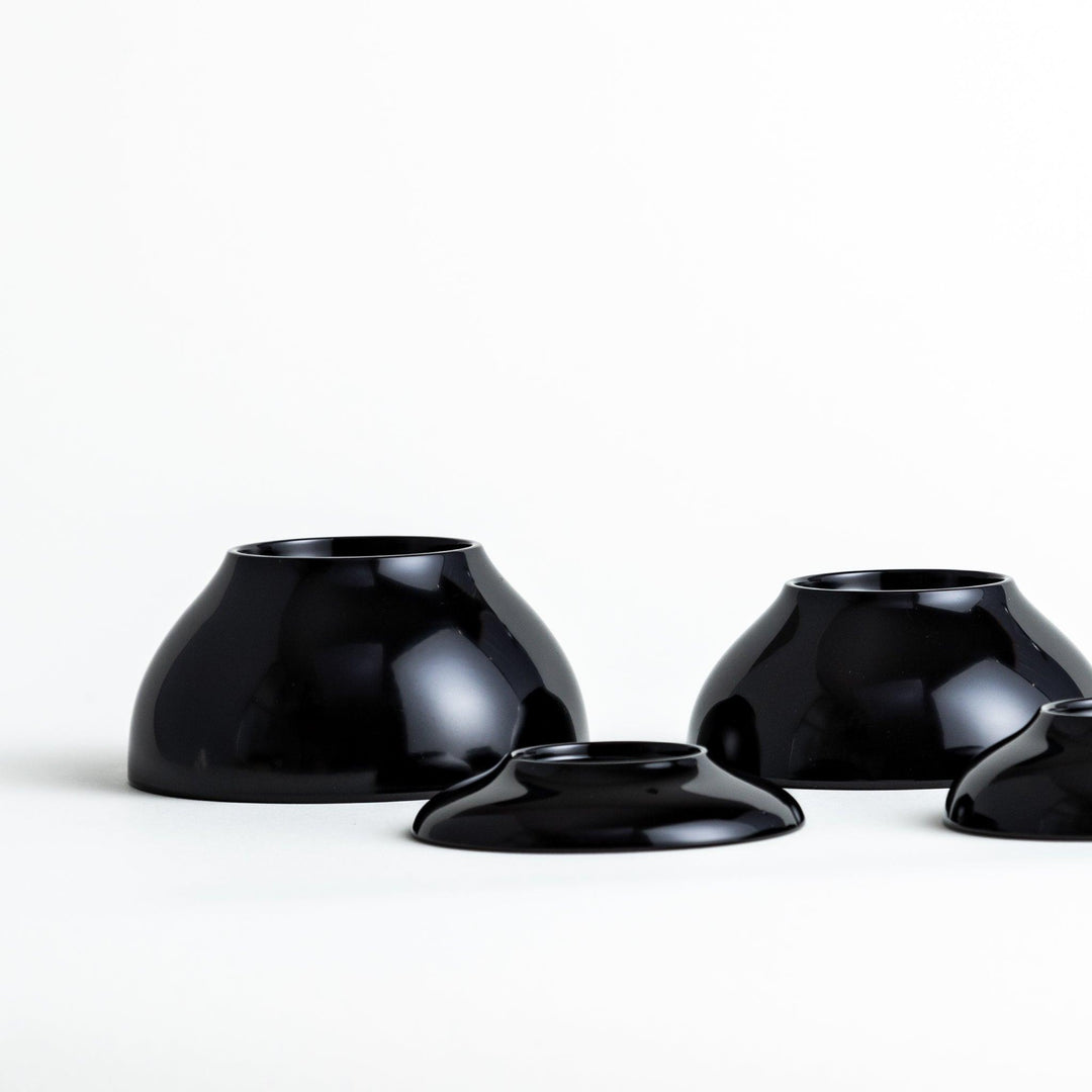 A set of five nested lacquer bowls, commonly used in oryoki meals, representing minimalism and mindfulness. Available in black or red.