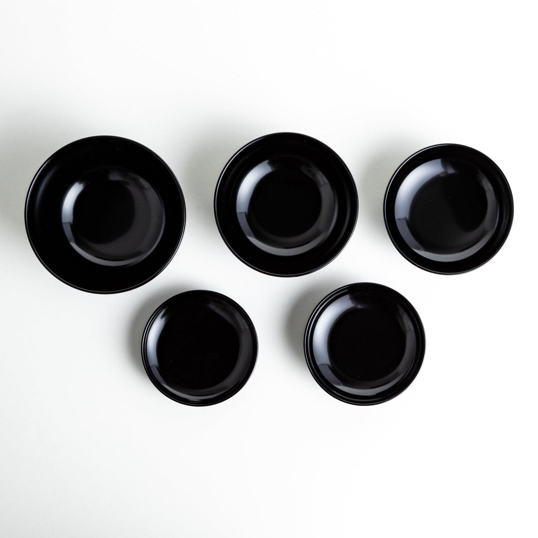 A set of five nested lacquer bowls, commonly used in oryoki meals, representing minimalism and mindfulness. Available in black or red.