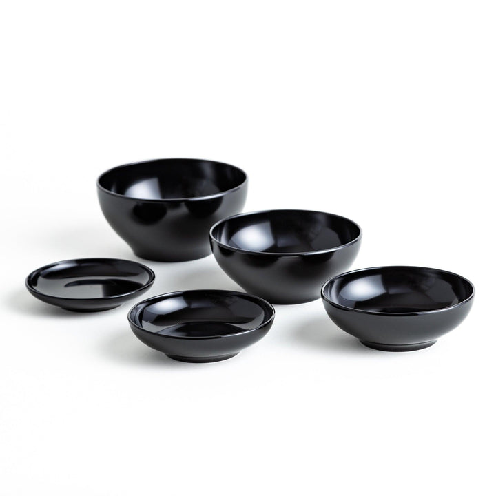 A set of five nested lacquer bowls, commonly used in oryoki meals, representing minimalism and mindfulness. Available in black or red.