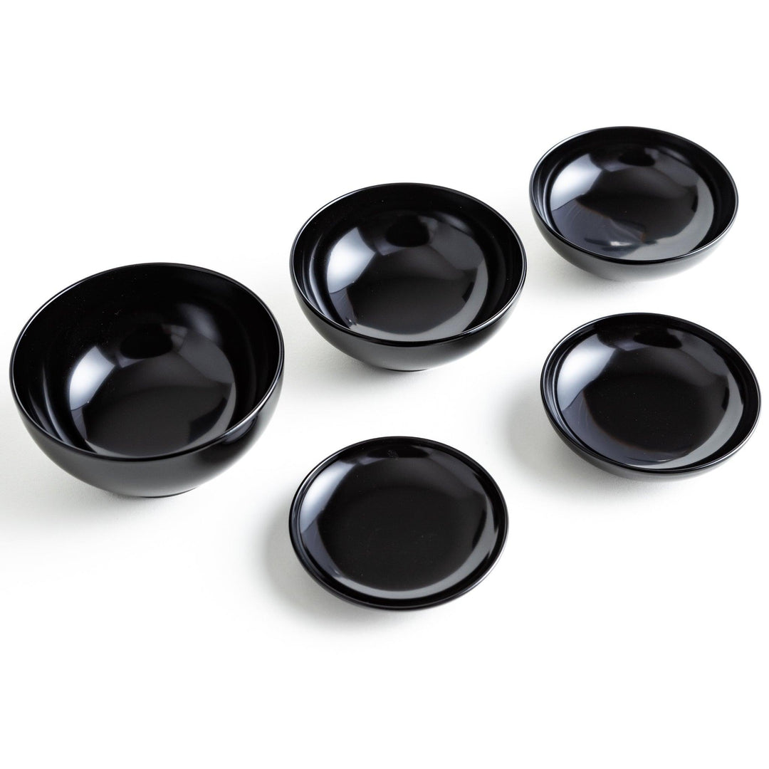 A set of five nested lacquer bowls, commonly used in oryoki meals, representing minimalism and mindfulness. Available in black or red.