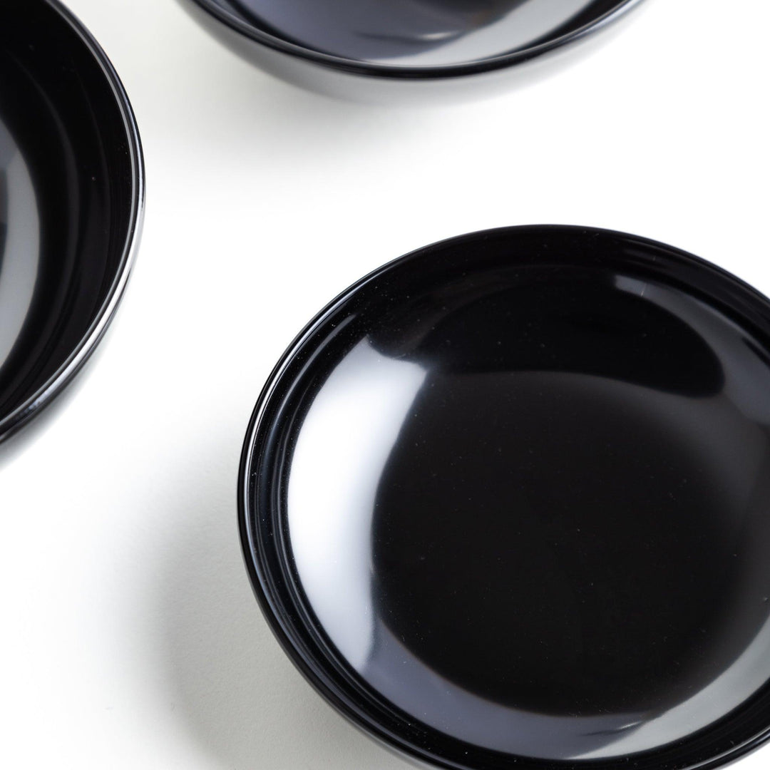 A set of five nested lacquer bowls, commonly used in oryoki meals, representing minimalism and mindfulness. Available in black or red.